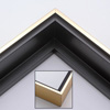 This solid wood canvas floater picture frame features a shiny brushed gold on the outside edge and narrow face.  The long inside step and base are a matte black. 

Display your favourite gallery wrapped canvas Giclée print or oil painting with authentic, fine art style. This canvas floating frame is ideal for large images on 1.5 " deep (thick) canvases.

*Note: These canvas floaters are for stretched canvas prints and paintings, and raised wood panels.